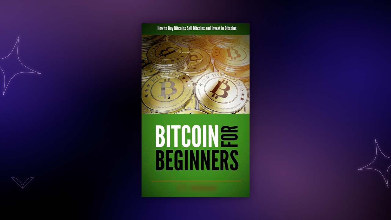 Beginner’s crypto investing book on a desk with laptop