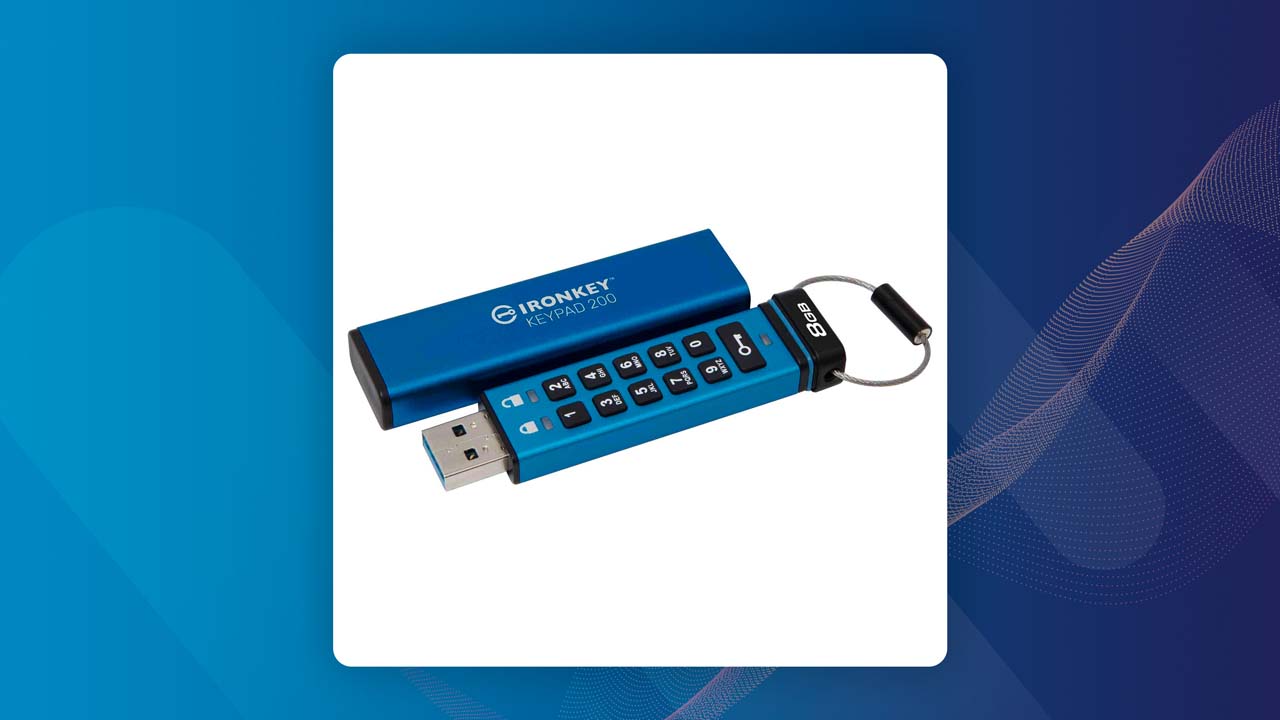 IronKey Secure USB 3.0 drive positioned beside a laptop showcasing encrypted data transfer.